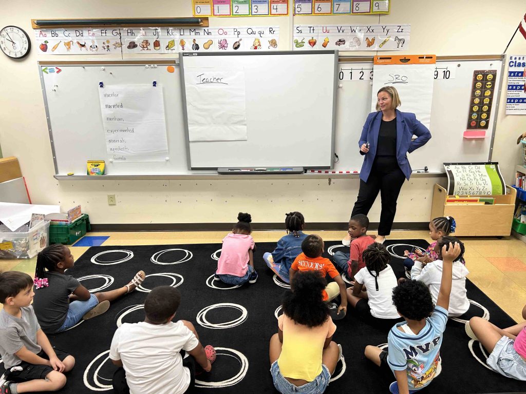 Lauren Sabo lecturing students in a classroom.